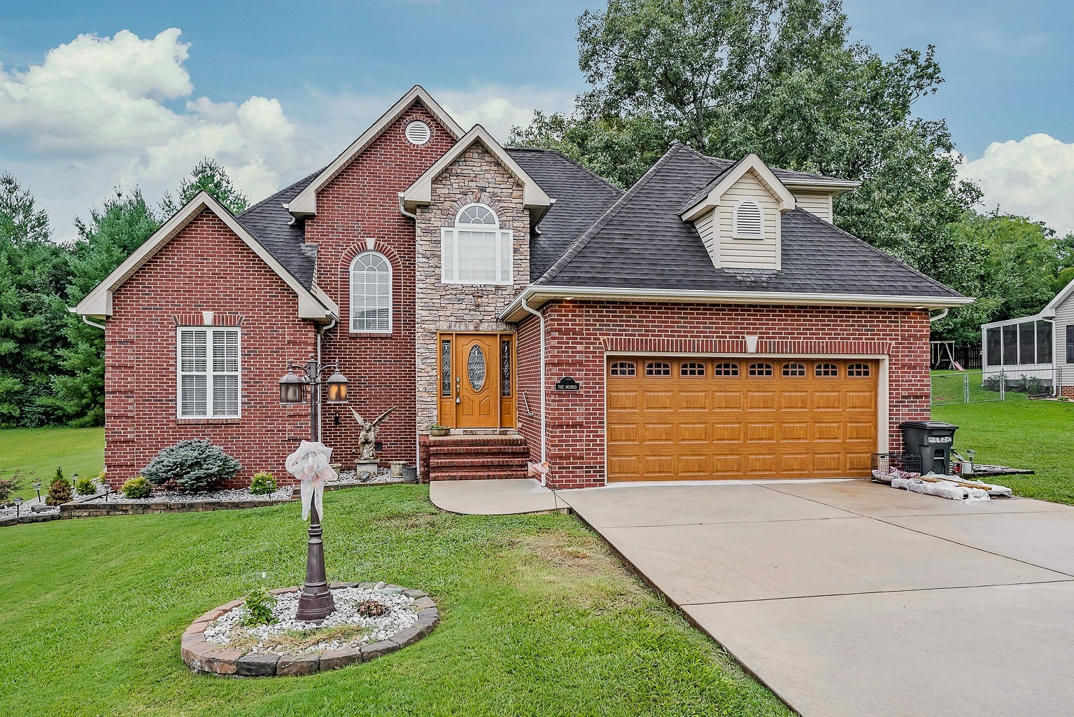 a front view of a house with a yard