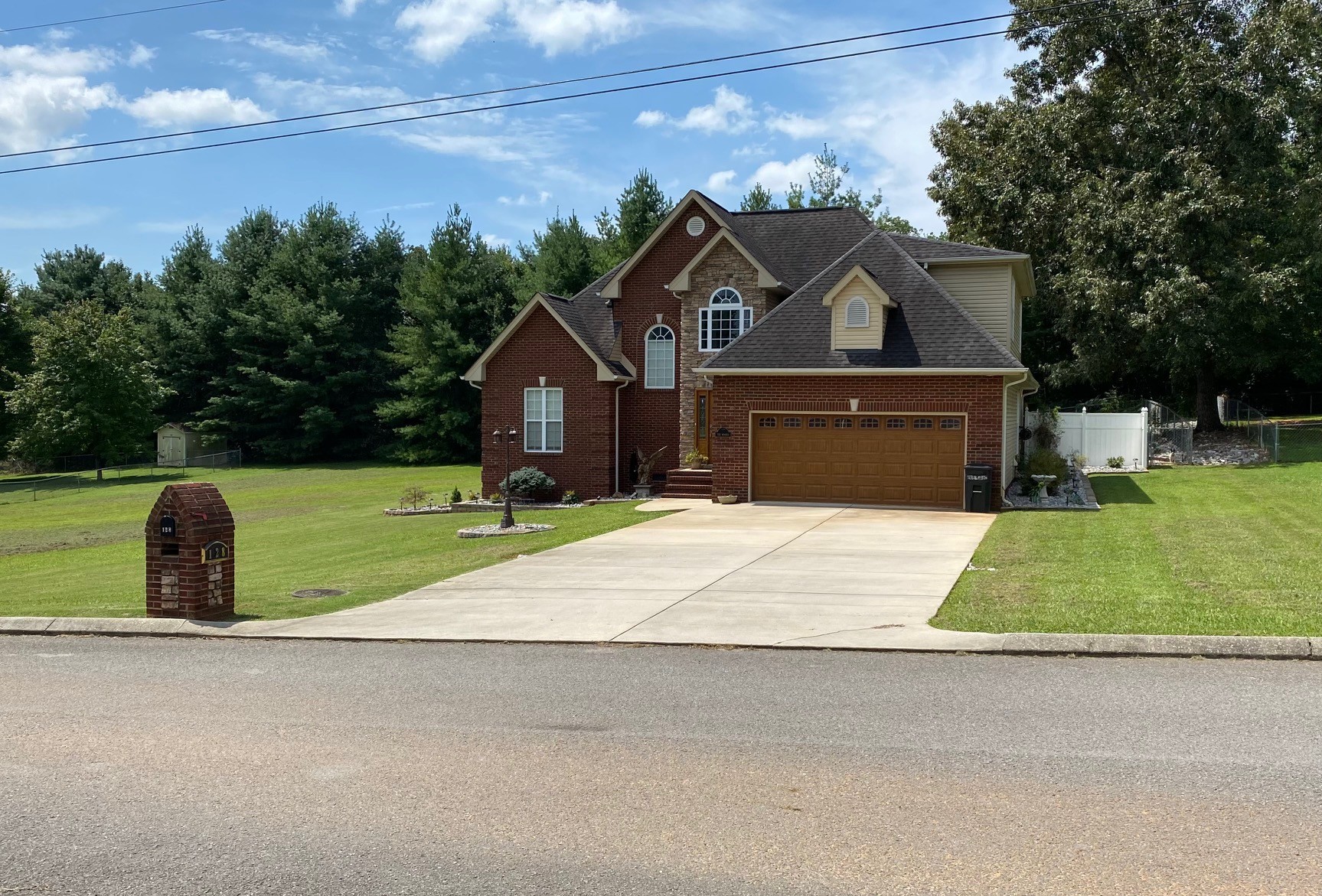 128 Simons Boulevard Morrison, TN 37357 - Photo 12 of 65 a front view of a house with a yard