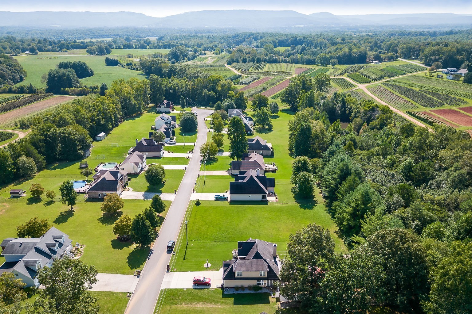 128 Simons Boulevard Morrison, TN 37357 - Photo 20 of 65 an aerial view of residential houses with outdoor space and parking