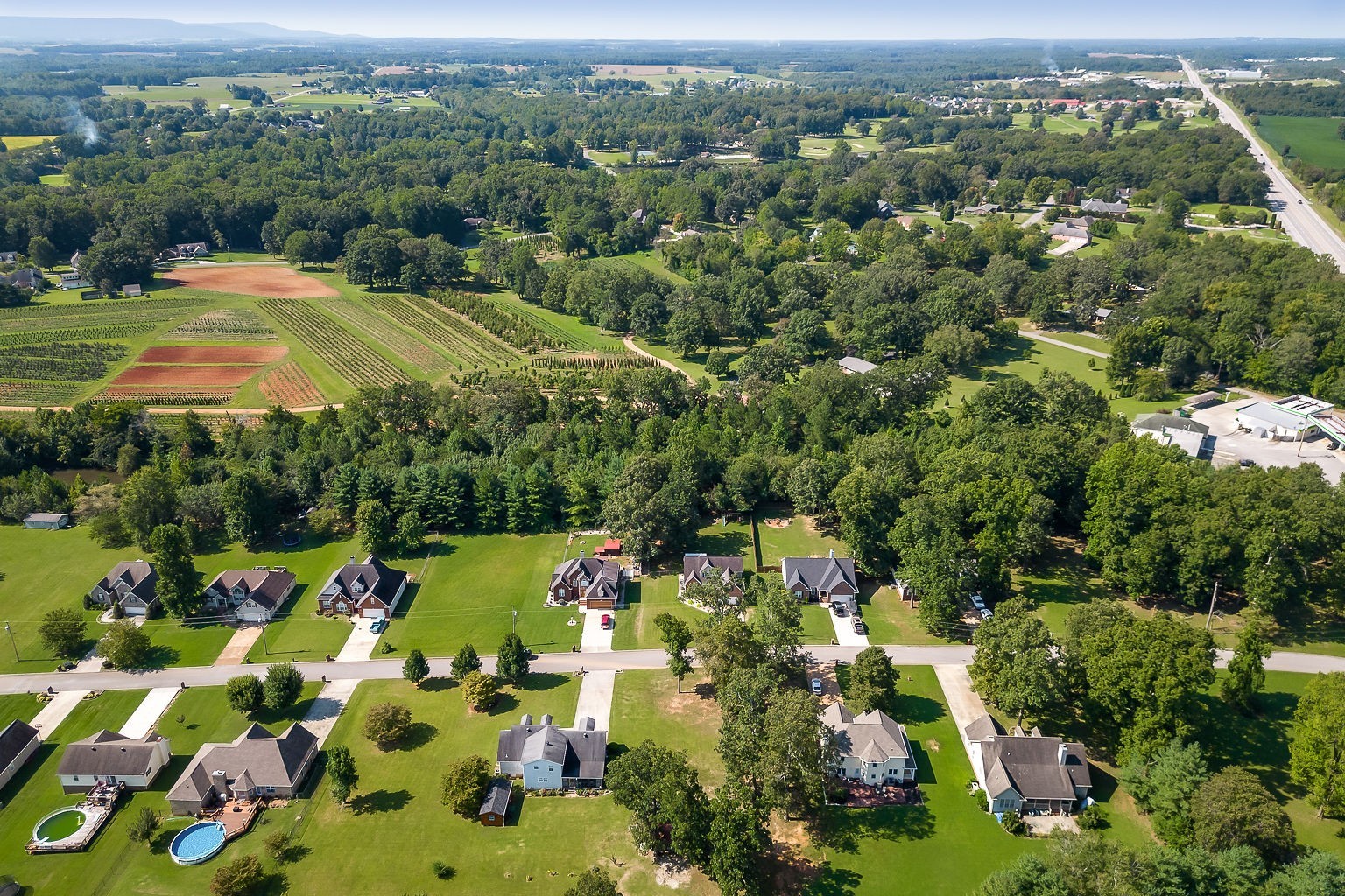 128 Simons Boulevard Morrison, TN 37357 - Photo 21 of 65 an aerial view of residential houses with outdoor space and trees