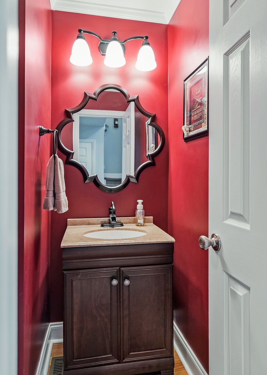128 Simons Boulevard Morrison, TN 37357 - Photo 31 of 65 a bathroom with a sink mirror and vanity