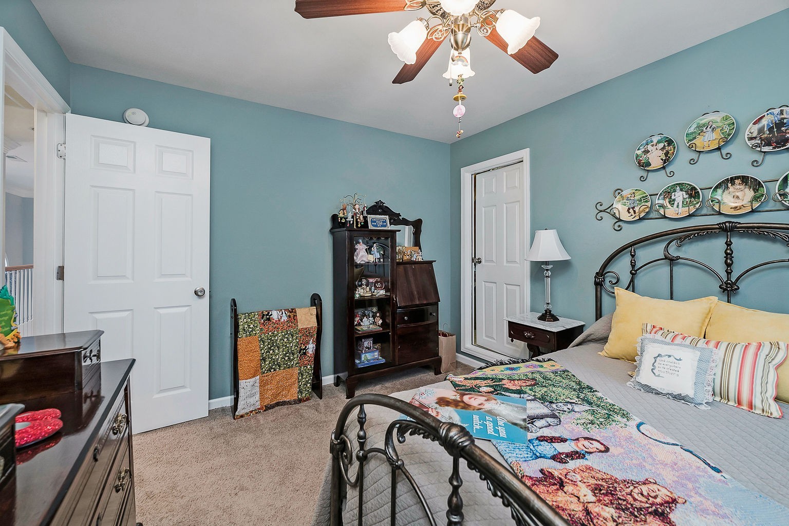 128 Simons Boulevard Morrison, TN 37357 - Photo 62 of 65 a bedroom with a bed and a chandelier