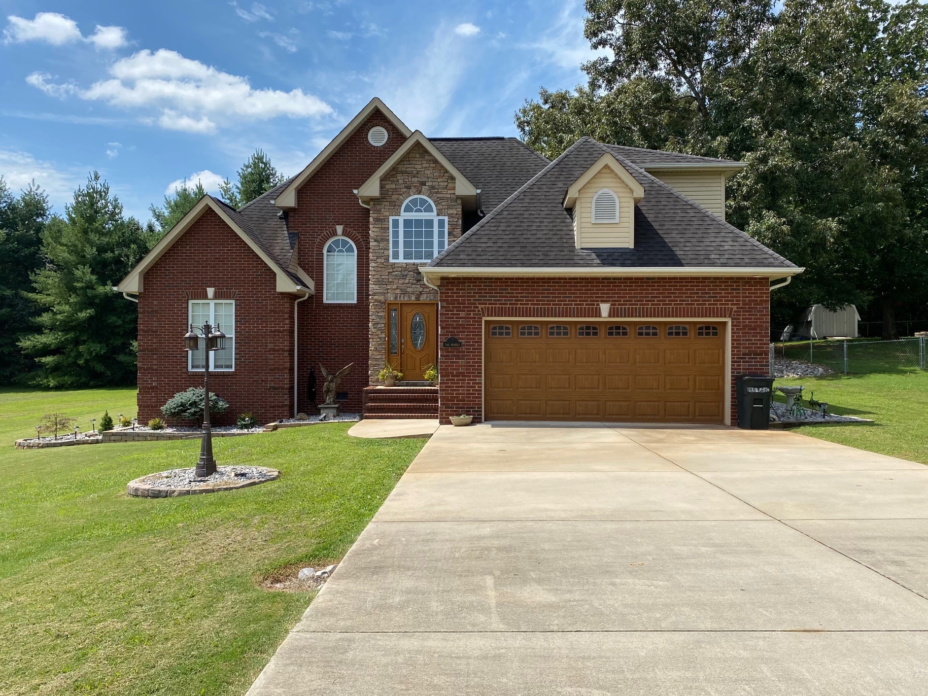 128 Simons Boulevard Morrison, TN 37357 - Photo 9 of 65 a front view of a house with a yard