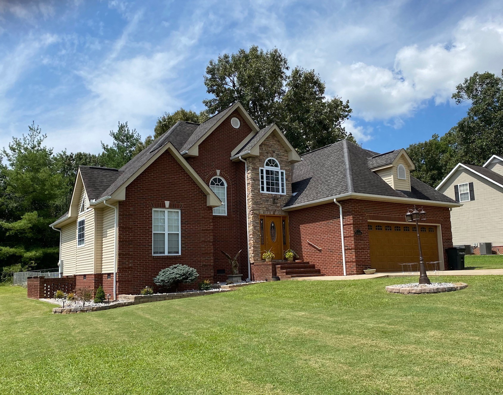 128 Simons Boulevard Morrison, TN 37357 - Photo 10 of 65 a front view of a house with a garden and yard