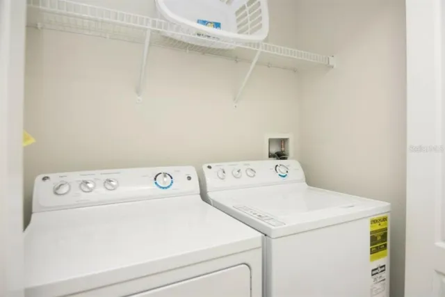 a utility room with dryer and washer