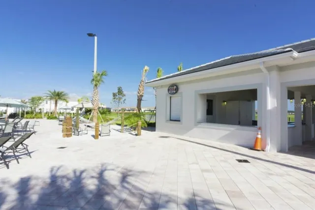 a view of a swimming pool with a lounge chair