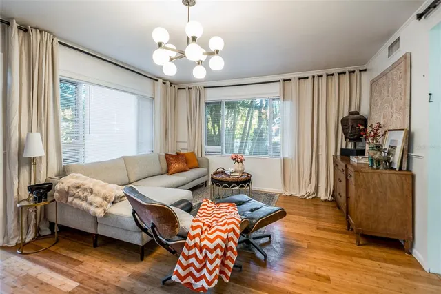 a spacious bedroom with a bed and large window