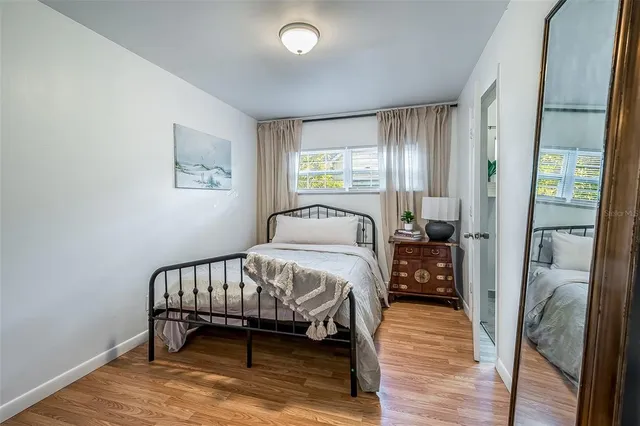 a white toilet sitting next to a bathroom sink and a shower