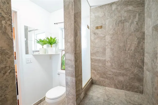 a living room with furniture and white walls