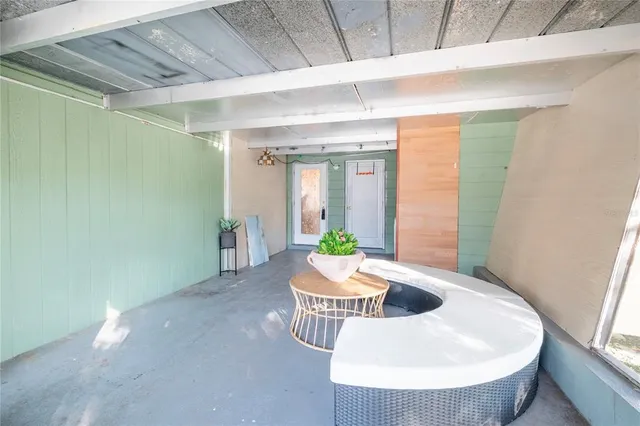 a view of a backyard with a tree