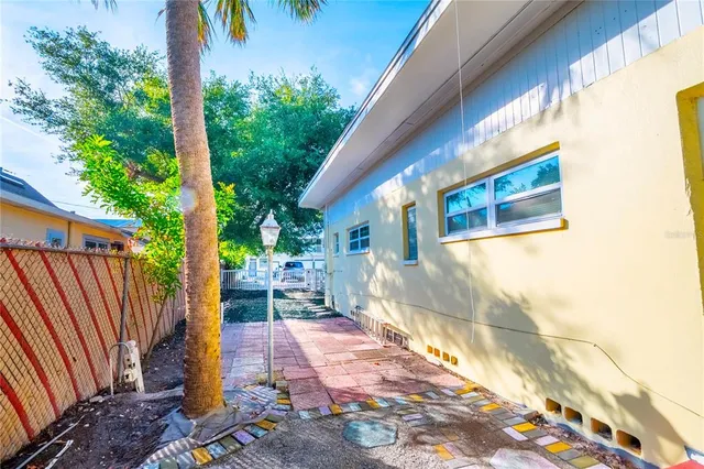 a kitchen with a refrigerator sink and cabinets