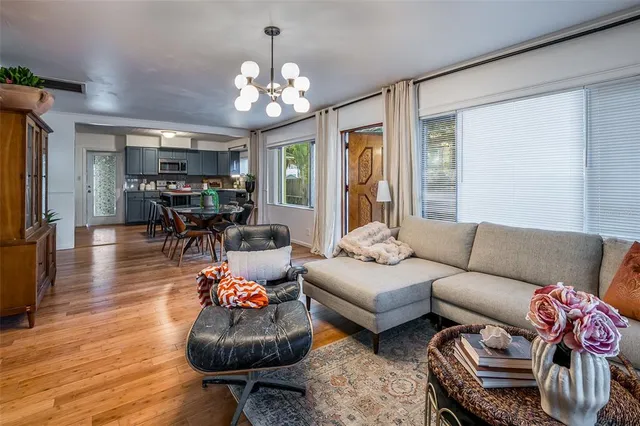 a dining room with furniture and wooden floor