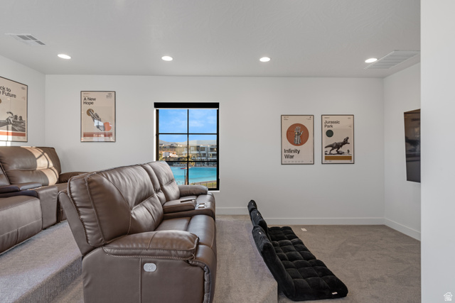 5367 Cyan Lane St. George, UT 84790 - Photo 47 of 49 Media room featuring tiered seating, recessed lighting, and a window with a water view