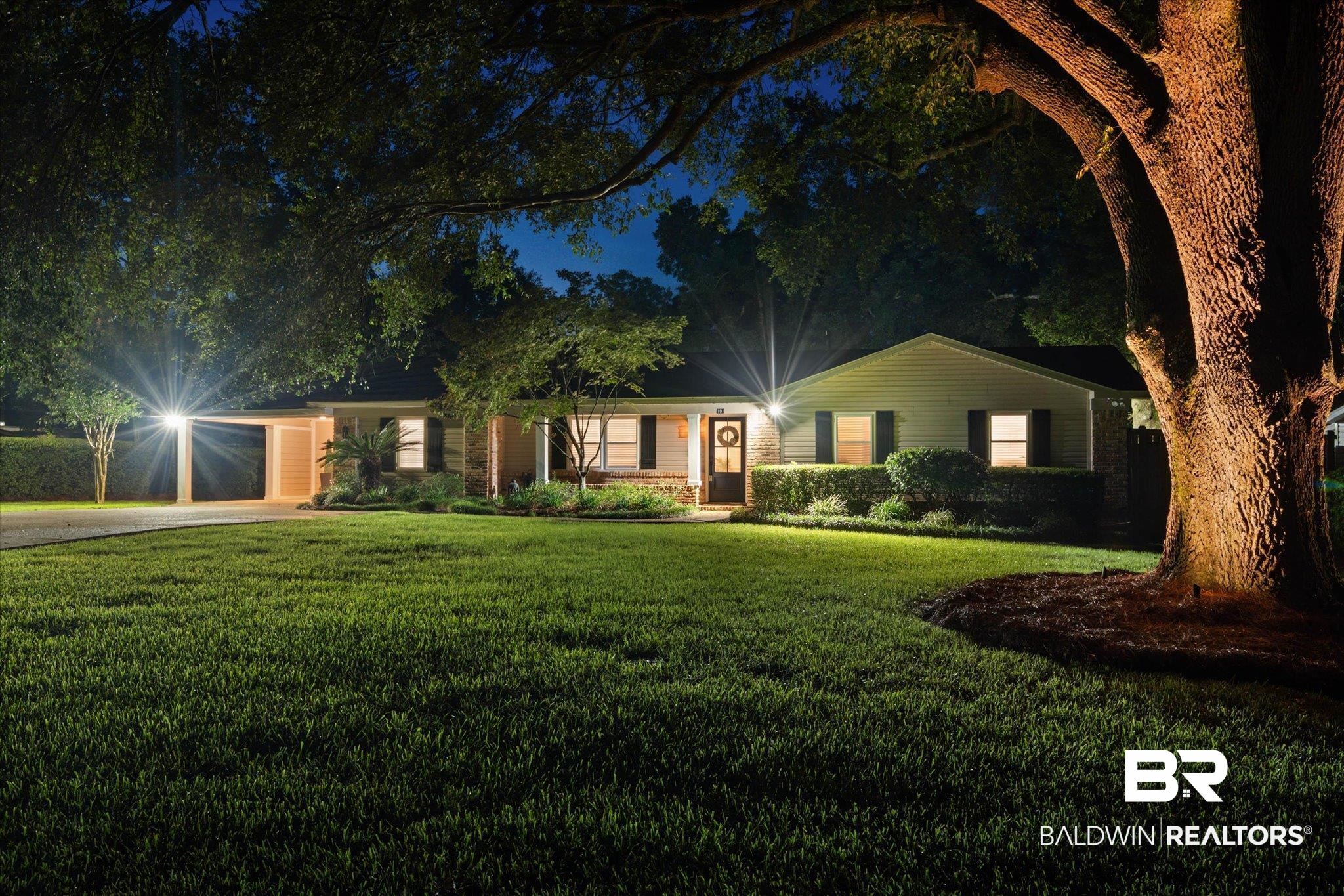 101 Ann Street Daphne, AL 36527 - Photo 34 of 38 Ranch-style residence featuring a prominent mature tree, a covered carport, and a paved driveway