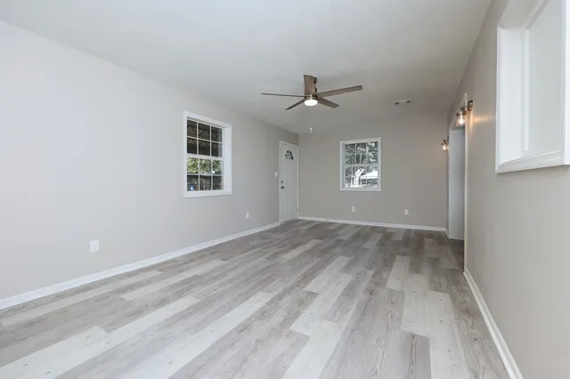 a view of an empty room with a window