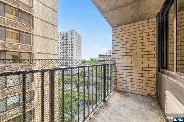 a view of a balcony with a pot