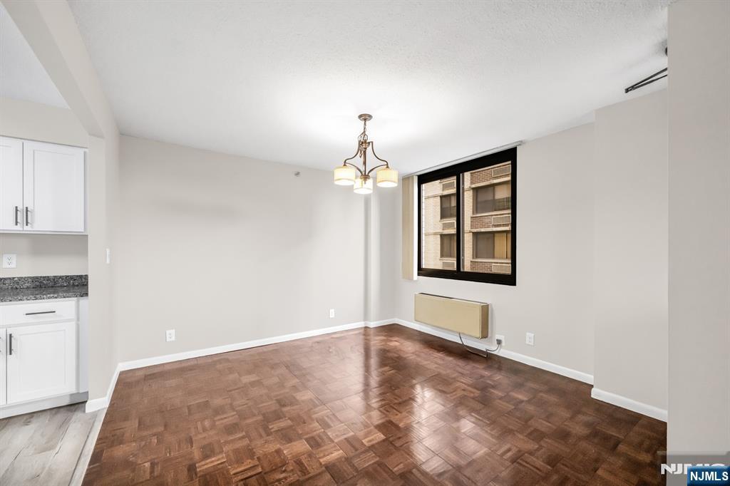 326 Prospect Avenue, Unit 6J Hackensack, NJ 07601 - Photo 8 of 18 a view of an empty room with window and cabinet