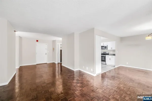 a view of an empty room with closet