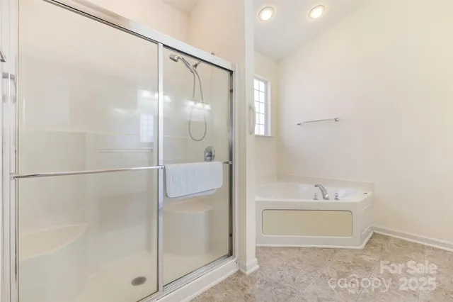 a bathroom with a shower and a sink