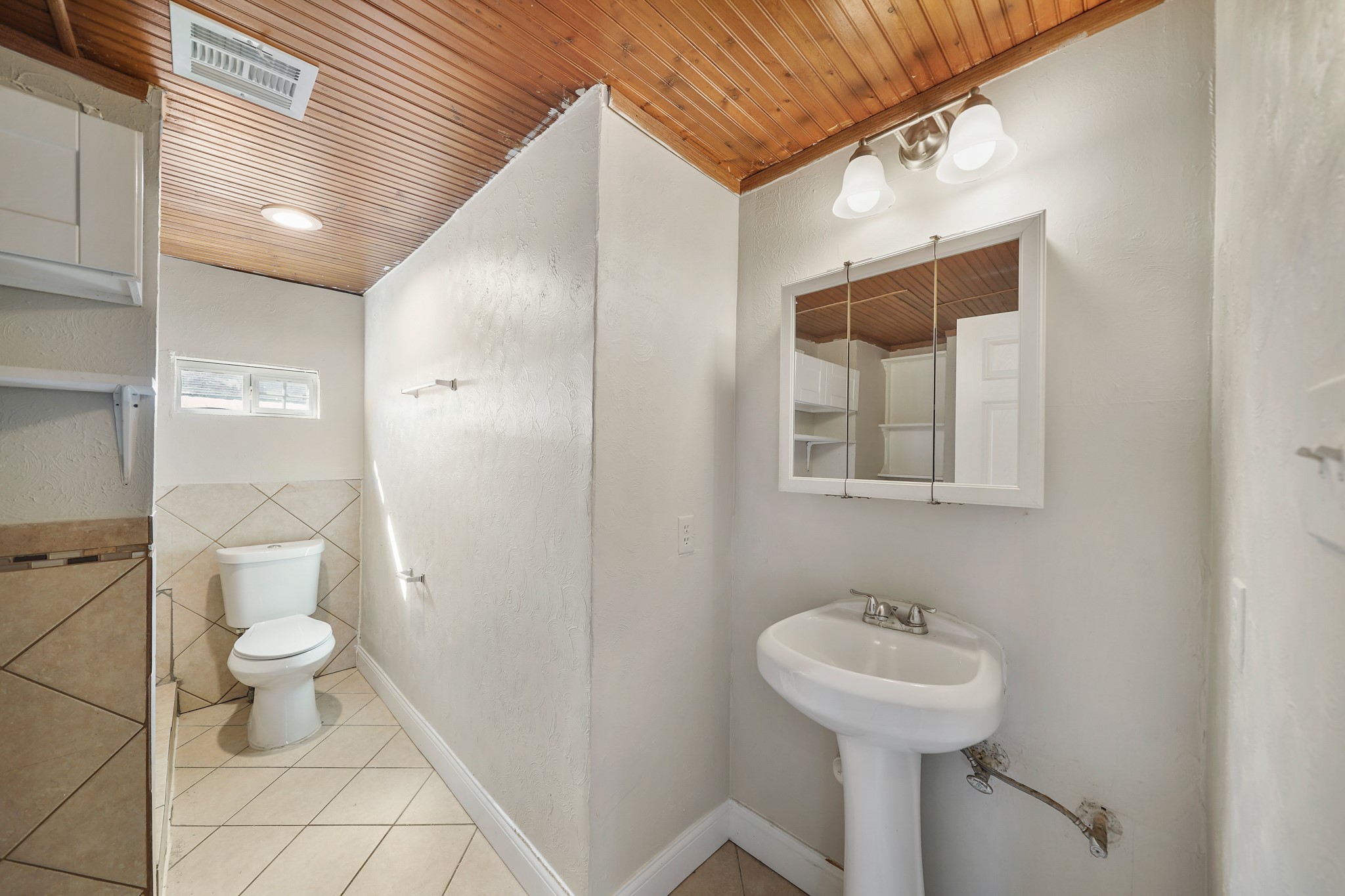 10001 Lucore Street, Unit FRONT Houston, TX 77017 - Photo 8 of 11 a bathroom with a sink toilet and shower