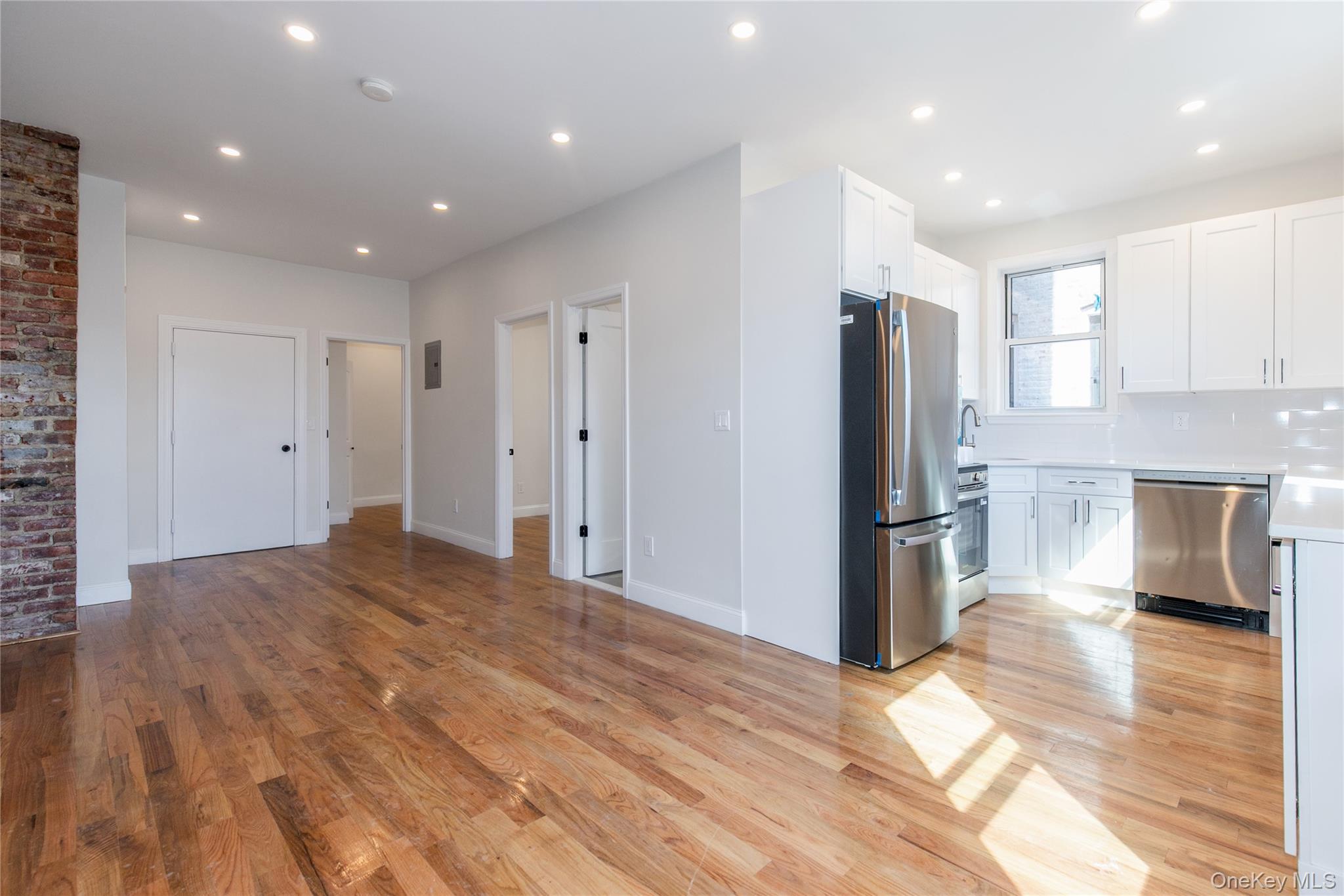 104-44 42nd Avenue Queens, NY 11368 - Photo 1 of 16 a view of a kitchen with a refrigerator and a stove top oven