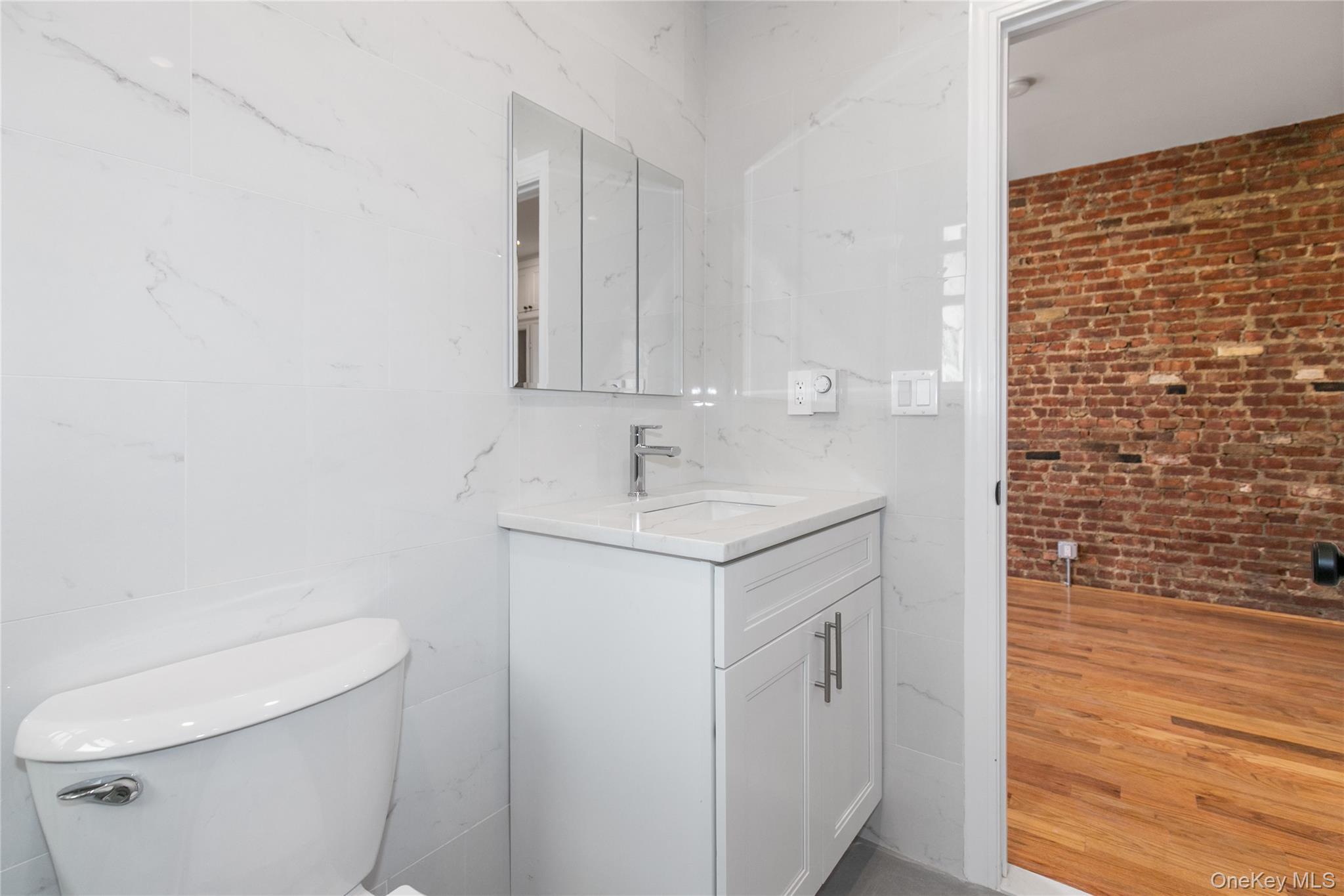 104-44 42nd Avenue Queens, NY 11368 - Photo 14 of 16 a bathroom with a sink a toilet and shower