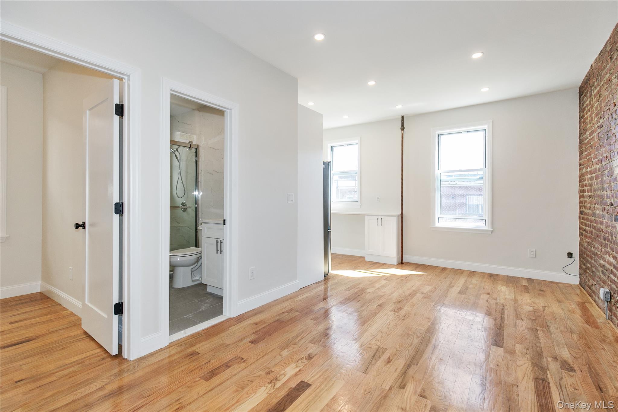 104-44 42nd Avenue Queens, NY 11368 - Photo 5 of 16 a view of livingroom with front door and wooden floor
