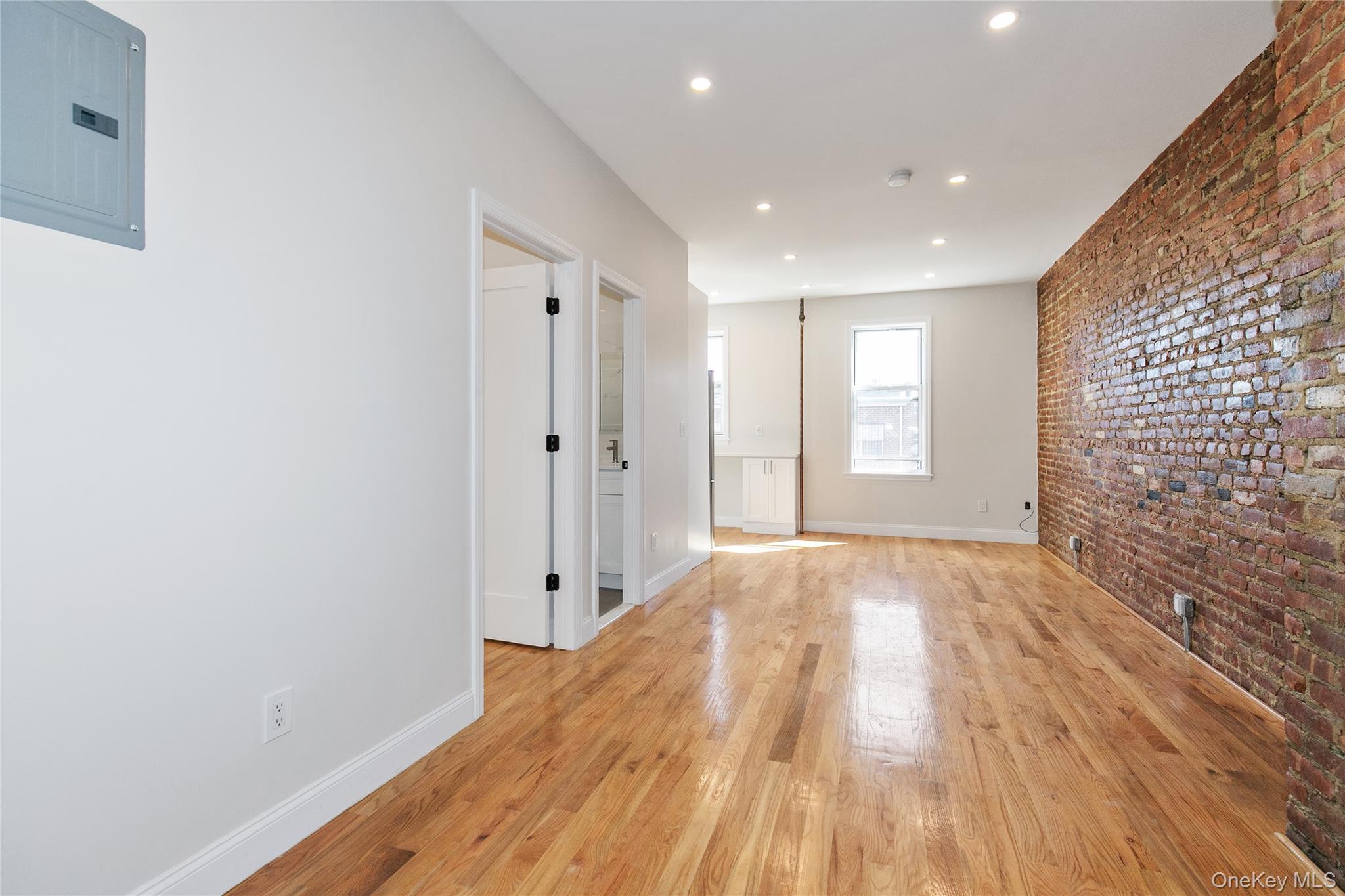 104-44 42nd Avenue Queens, NY 11368 - Photo 9 of 16 a view of empty room with wooden floor and fan