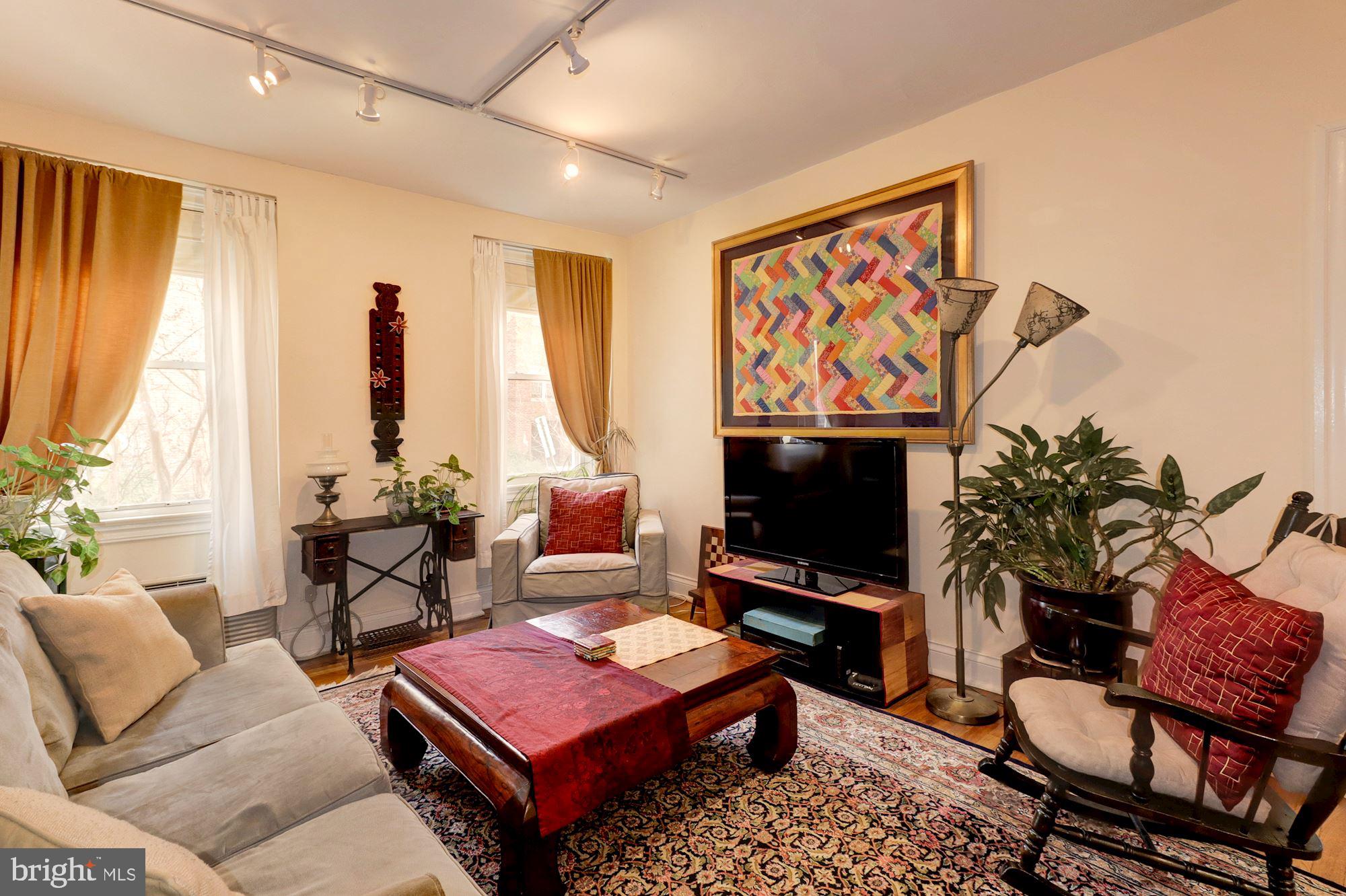 2801 Adams Mill Road Northwest, Unit 111 Washington, DC 20009 - Photo 6 of 24 Living room with bright windows