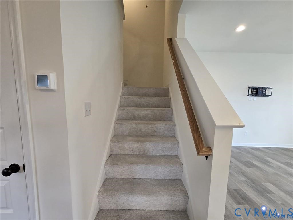 7825 Old Guild Road Richmond, VA 23237 - Photo 13 of 27 Carpeted staircase with a natural wood handrail, l