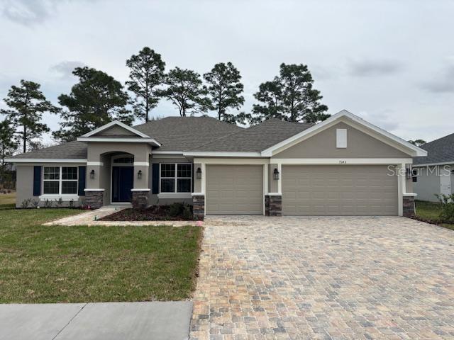 7143 Southwest 179th Ct Road Dunnellon, FL 34432 - Photo 1 of 1 a front view of a house with garden