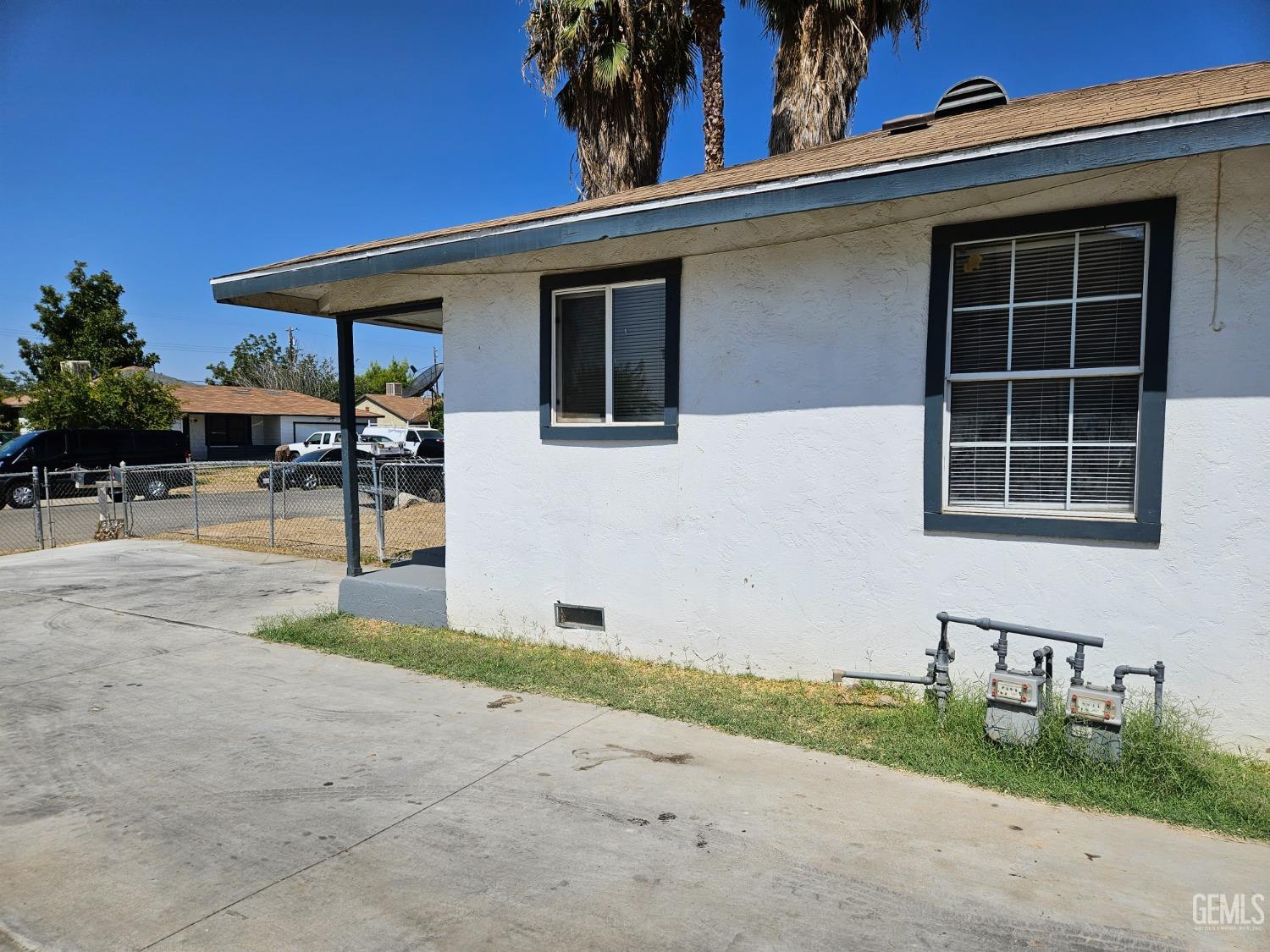 Undisclosed Address Bakersfield, CA 93307 - Photo 3 of 17 a backyard of a house with table and chairs