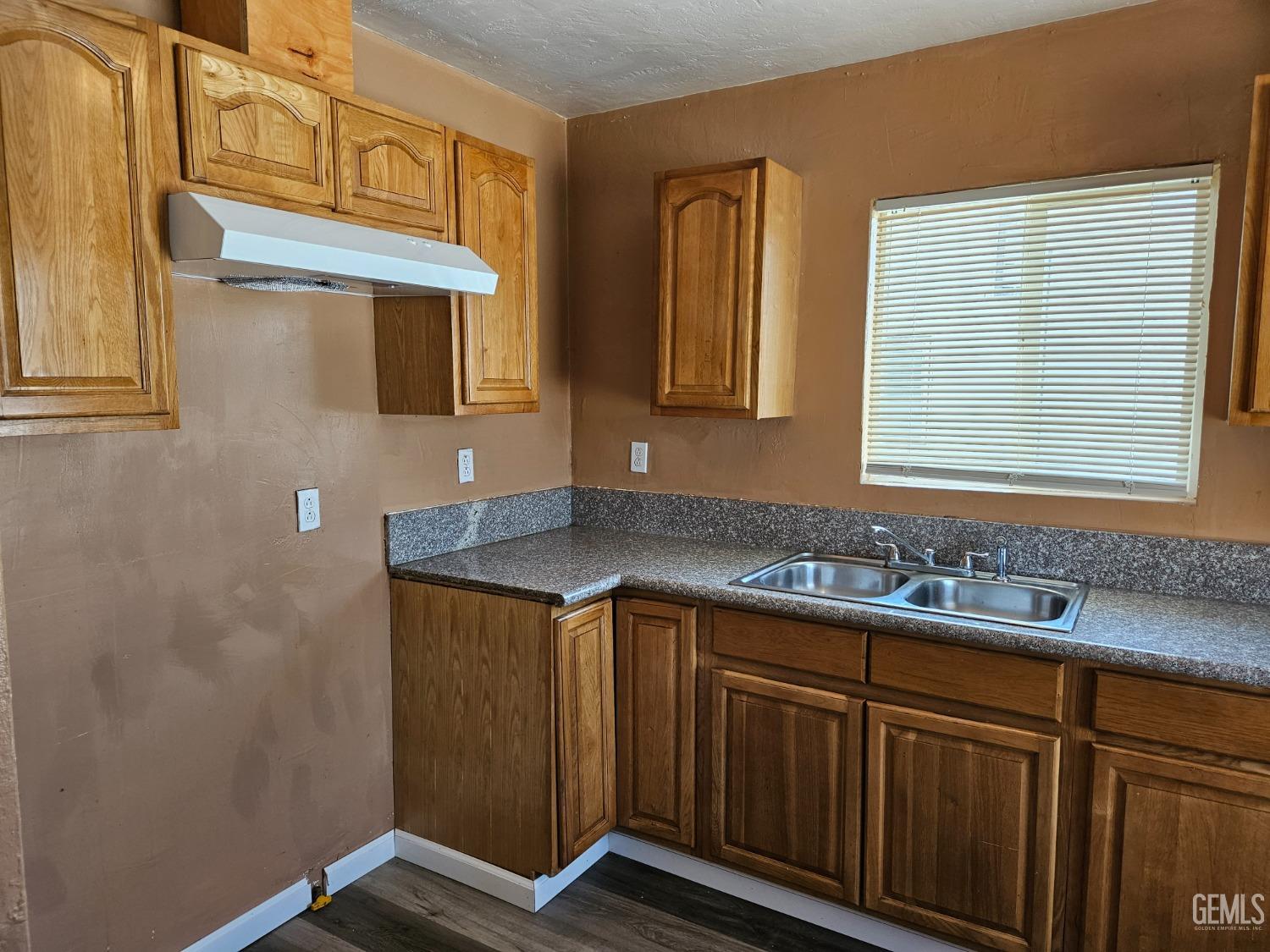 Undisclosed Address Bakersfield, CA 93307 - Photo 5 of 17 a bathroom with a sink and a mirror