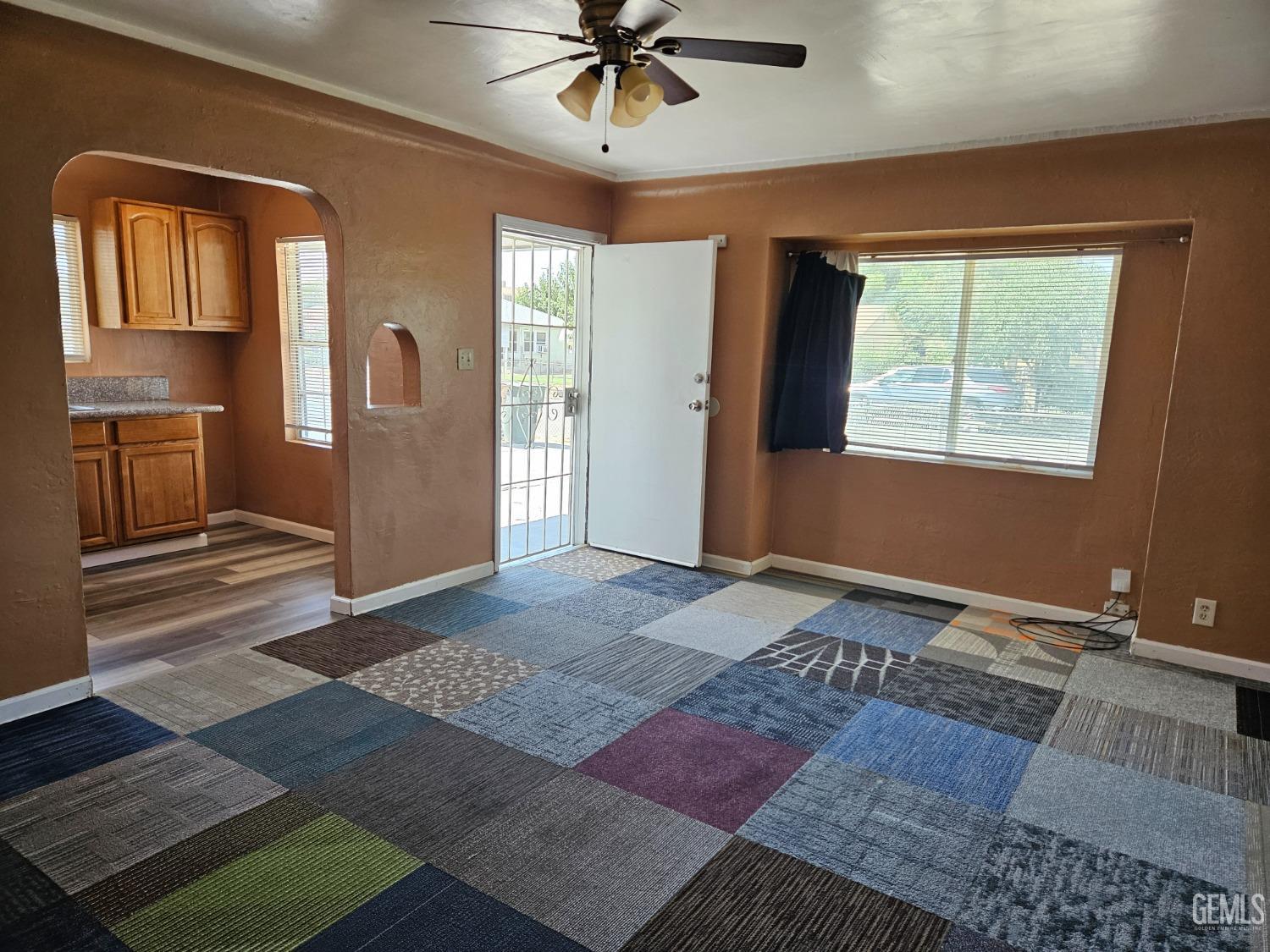 Undisclosed Address Bakersfield, CA 93307 - Photo 6 of 17 a living room with a couch and a window