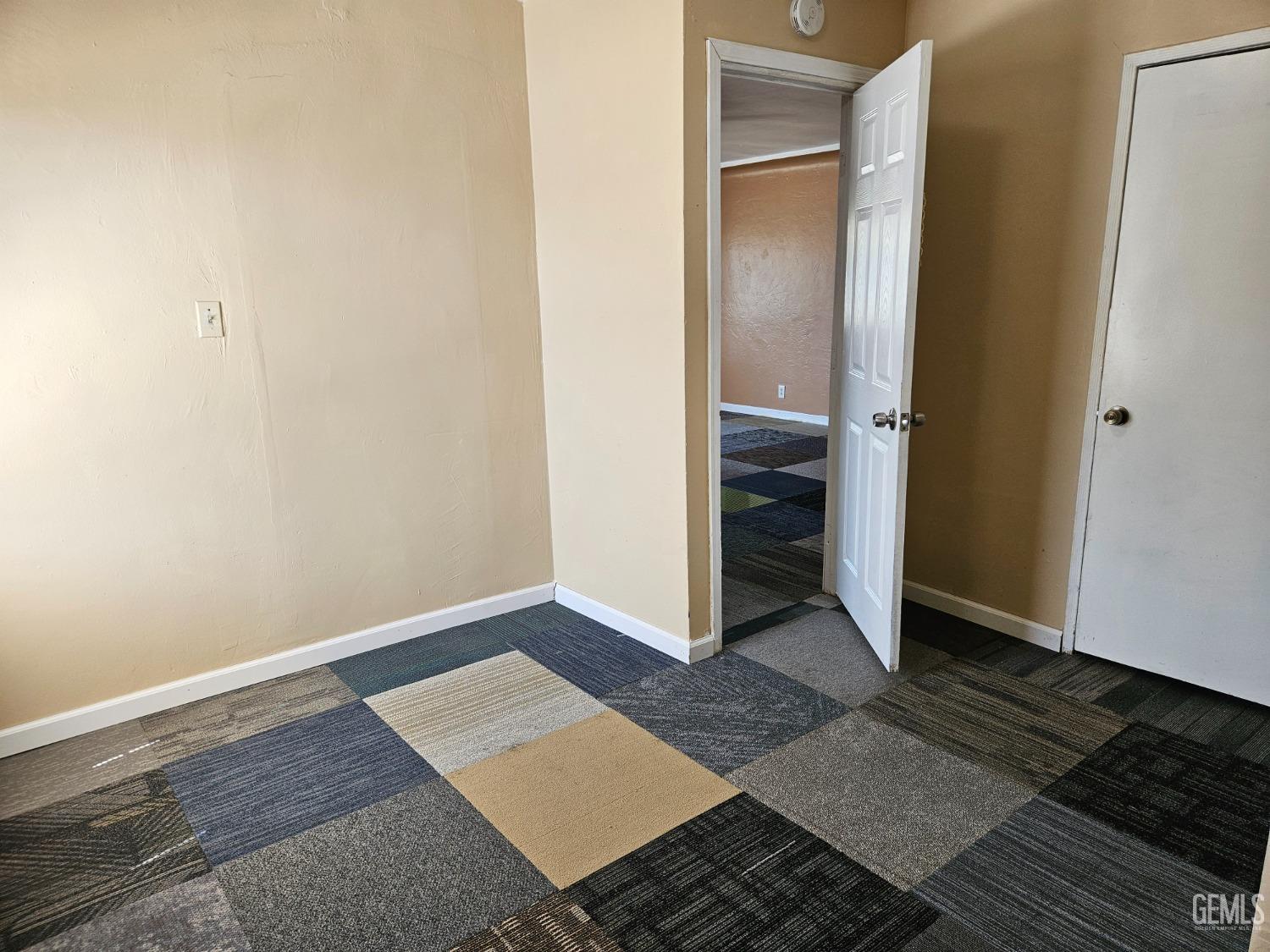 Undisclosed Address Bakersfield, CA 93307 - Photo 9 of 17 a view of an empty room with wooden floor