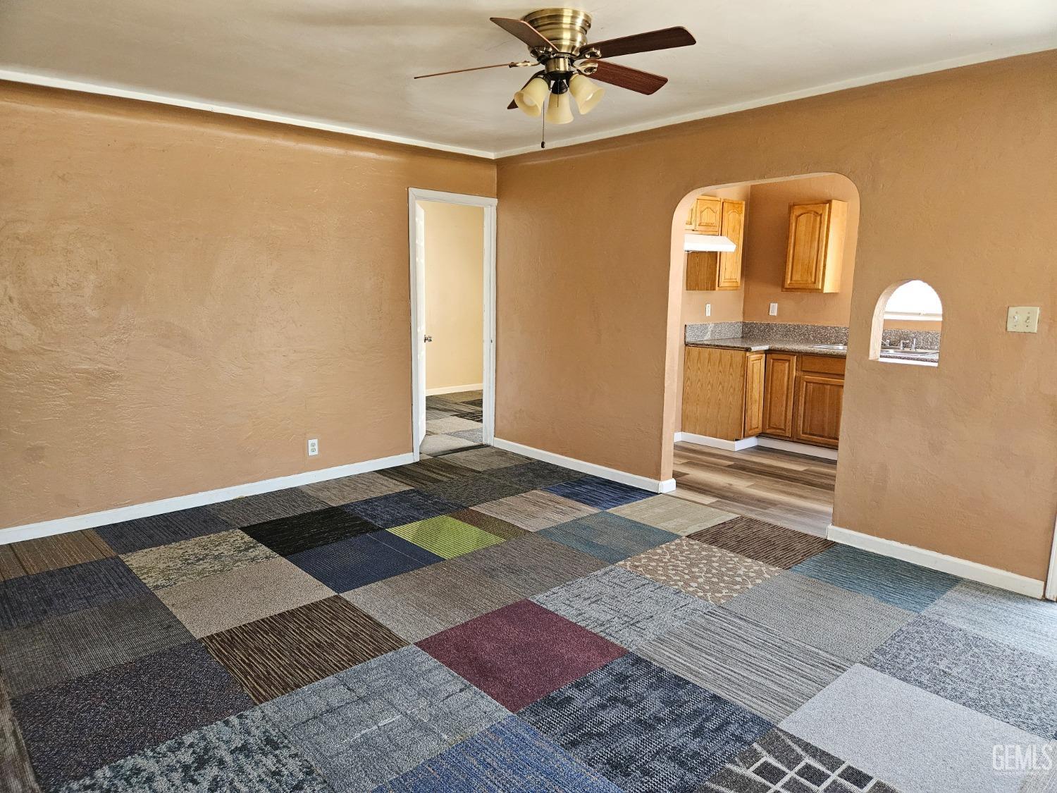 Undisclosed Address Bakersfield, CA 93307 - Photo 10 of 17 a view of a bedroom with wooden floor and ceiling fan