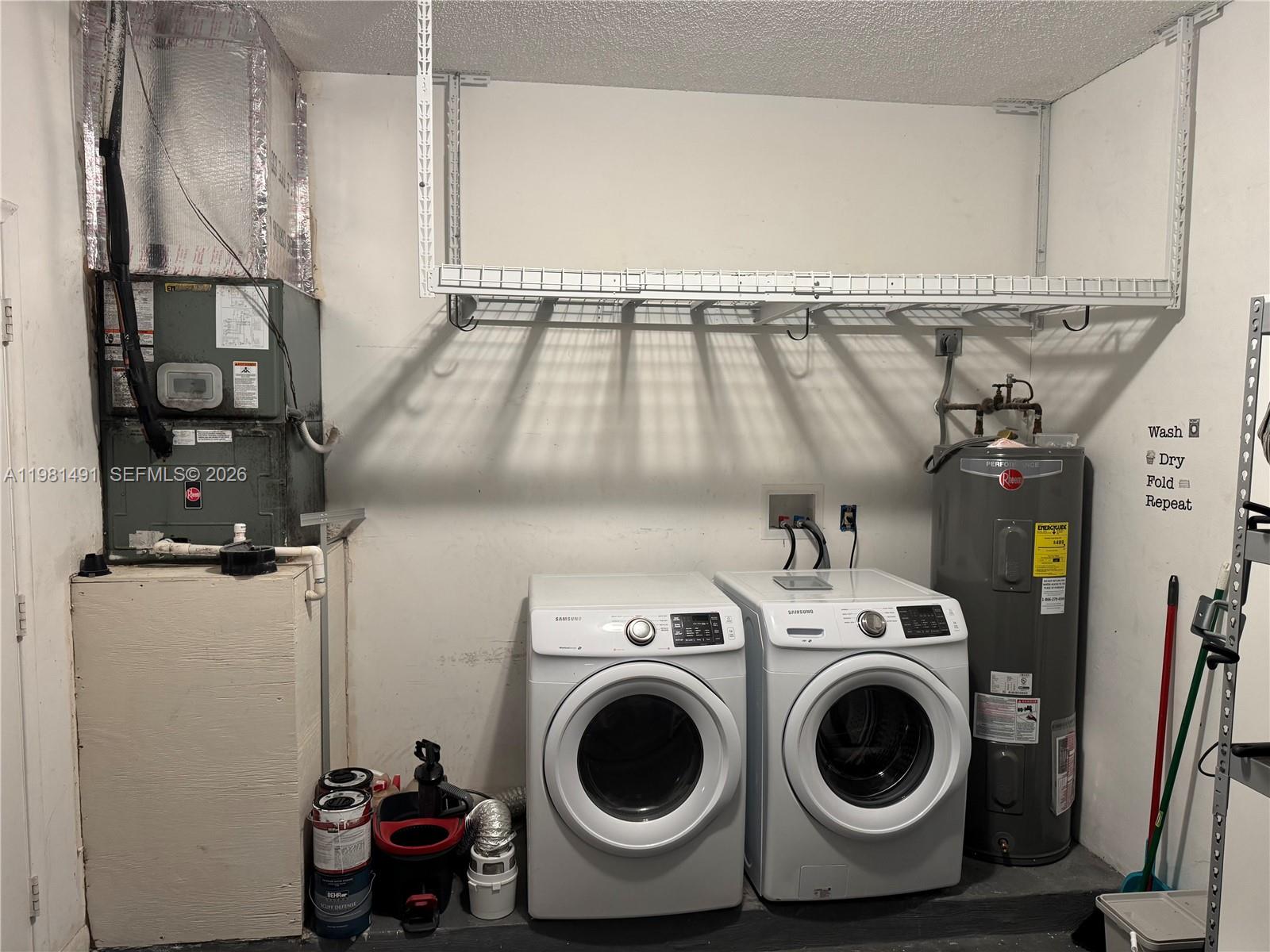 20478 Vía Marisa Boca Raton, FL 33498 - Photo 16 of 18 a utility room with dryer and washer