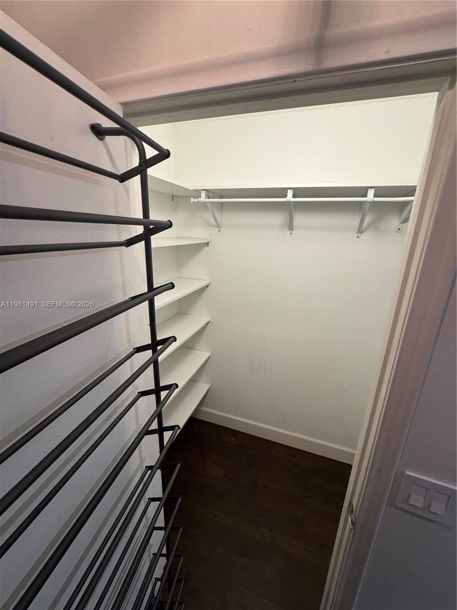 20478 Vía Marisa Boca Raton, FL 33498 - Photo 9 of 18 a view of a room with racks on the wall