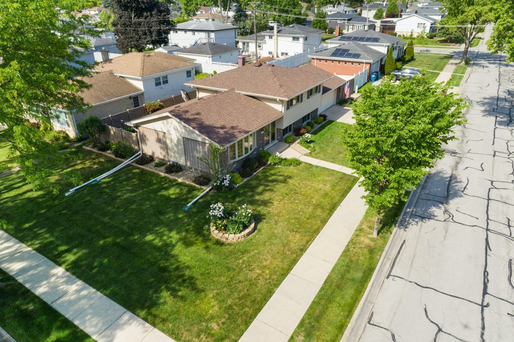 365 West Myrick Avenue Addison, IL 60101 - Photo 40 of 49 an aerial view of a house with a garden and swimming pool