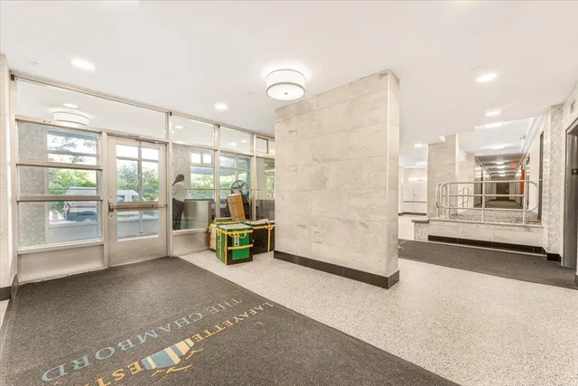 a view of a large room with a large window