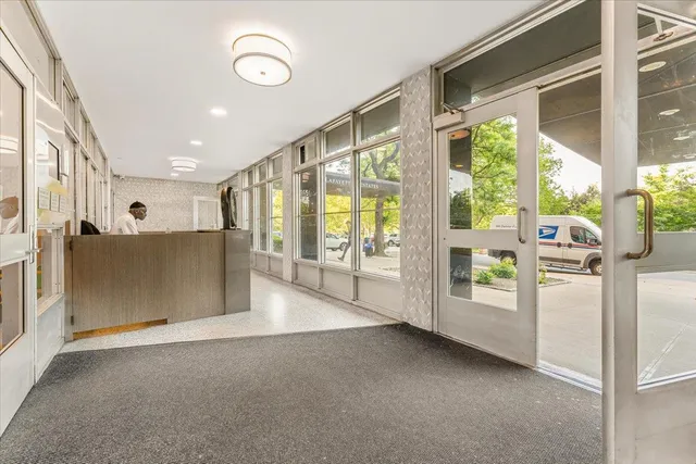 a view of a street with a bench in the background