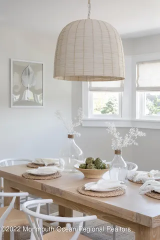 a view of a dining table and chandelier