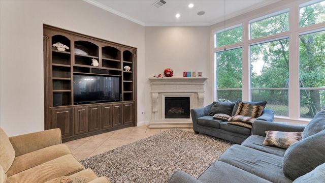 a dining room with furniture a chandelier and wooden floor