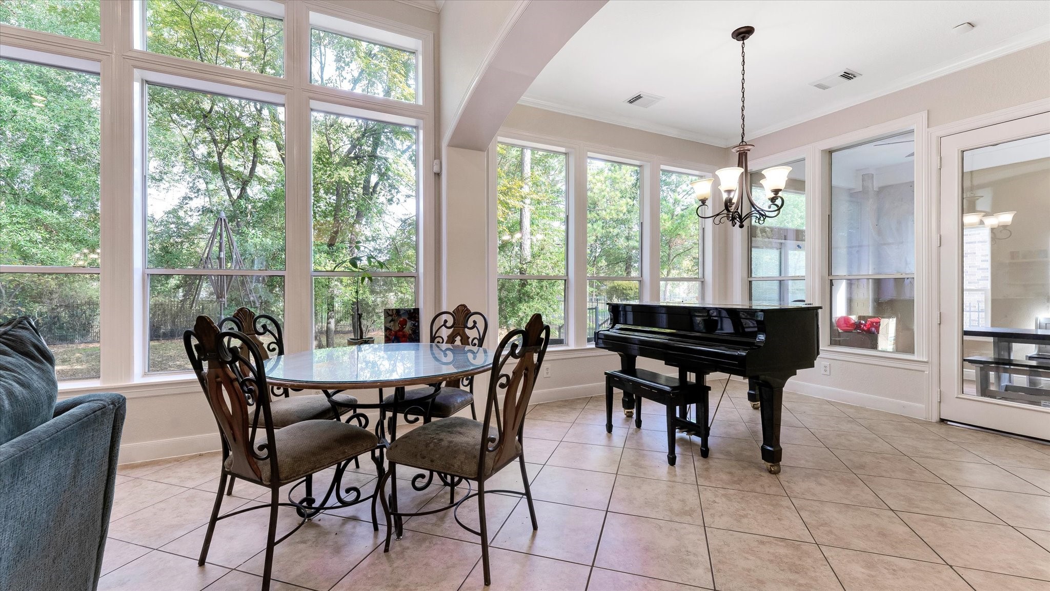 3 North Fair Manor Circle Spring, TX 77382 - Photo 12 of 39 a dining room with furniture a chandelier and wooden floor