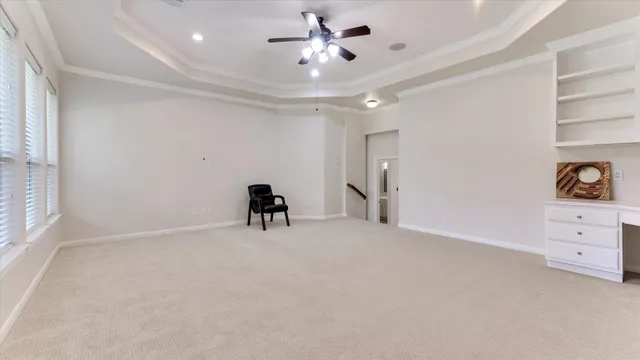 a spacious bathroom with a tub double sink and mirror