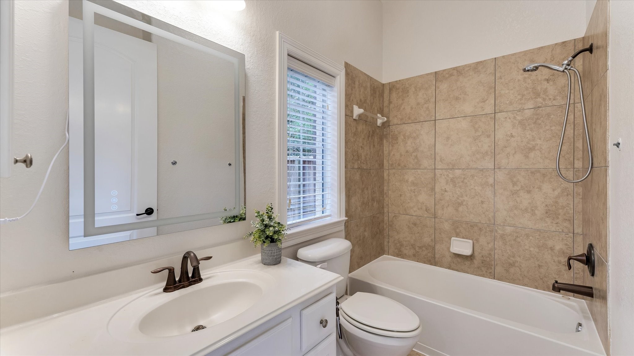 3 North Fair Manor Circle Spring, TX 77382 - Photo 28 of 39 a bathroom with a sink a toilet and shower