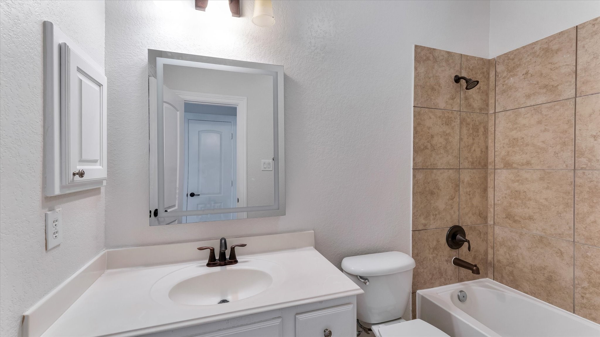 3 North Fair Manor Circle Spring, TX 77382 - Photo 33 of 39 a bathroom with a sink a toilet and shower
