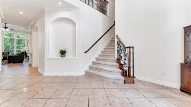 a view of a dining room with furniture and chandelier