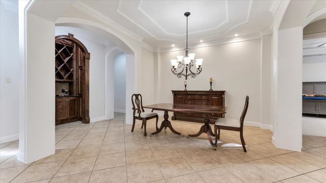 a living room with furniture and a book shelf
