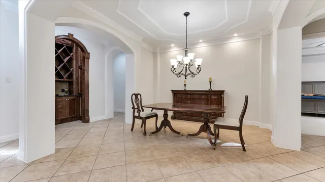 a living room with furniture and a book shelf